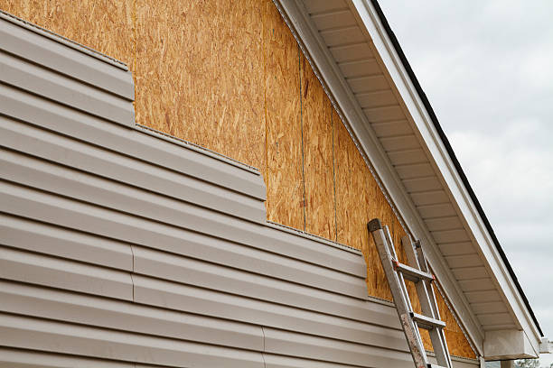 Professional Emergency Siding Repair technician working in East Islip, NY